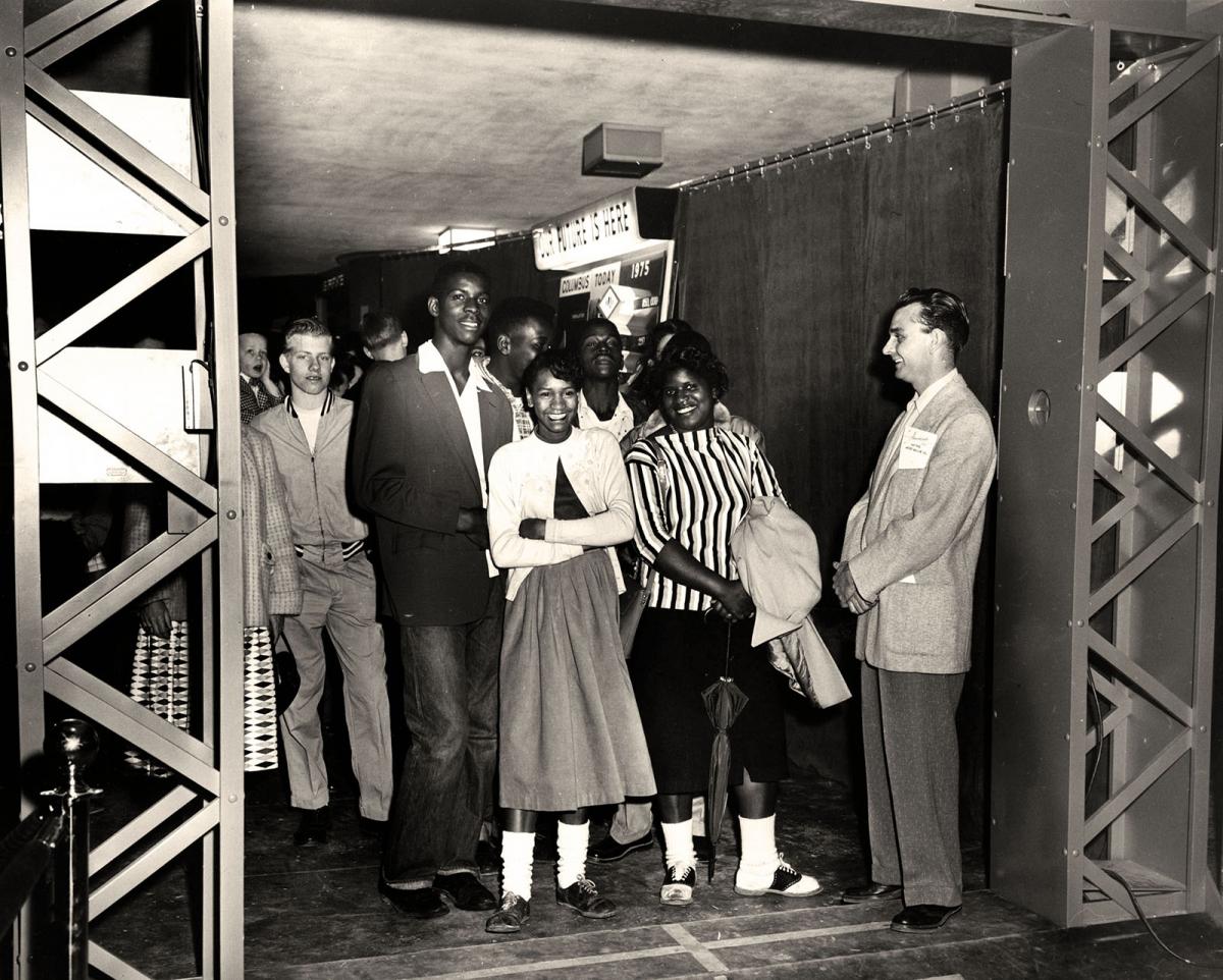 Teens line up to enter the exhibit