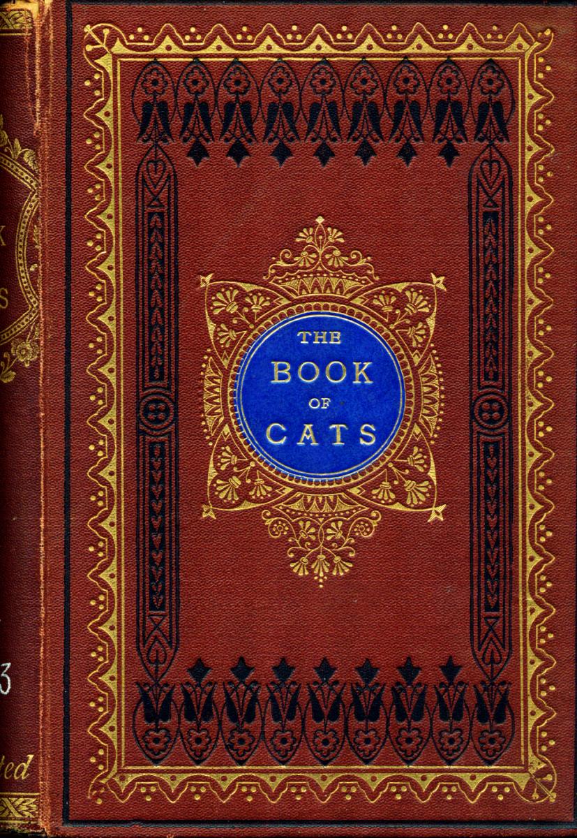 A red book with intricate patterns in black and gold. The center has a circle with the title "The Book of Cats"