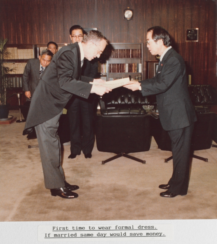 Jennings receiving the Order of the Sacred Treasure, Third Class, from the Minister of Posts and Telecom