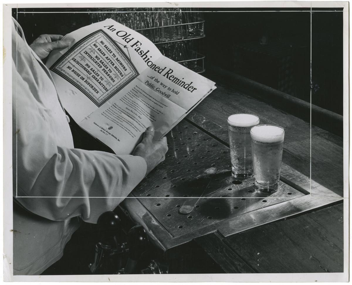 A man reads warnings about beer sales