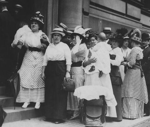 Women waiting in line for their bank