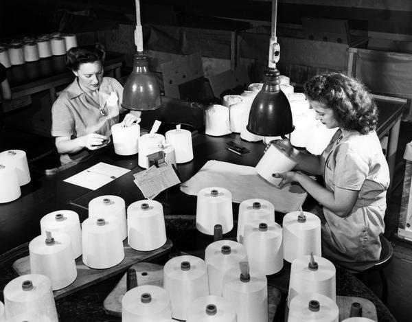 Inspecting yarn at DuPont rayon plant