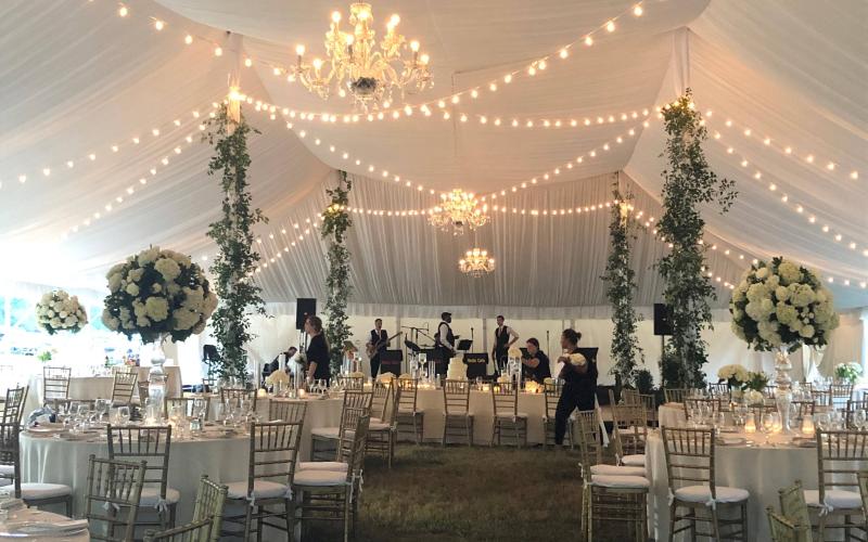 band sets up at tented ceremony