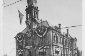 Black and white image of a courthouse decorated with bunting in honor of the Union Veterans Legion (Wilmington, Del.)